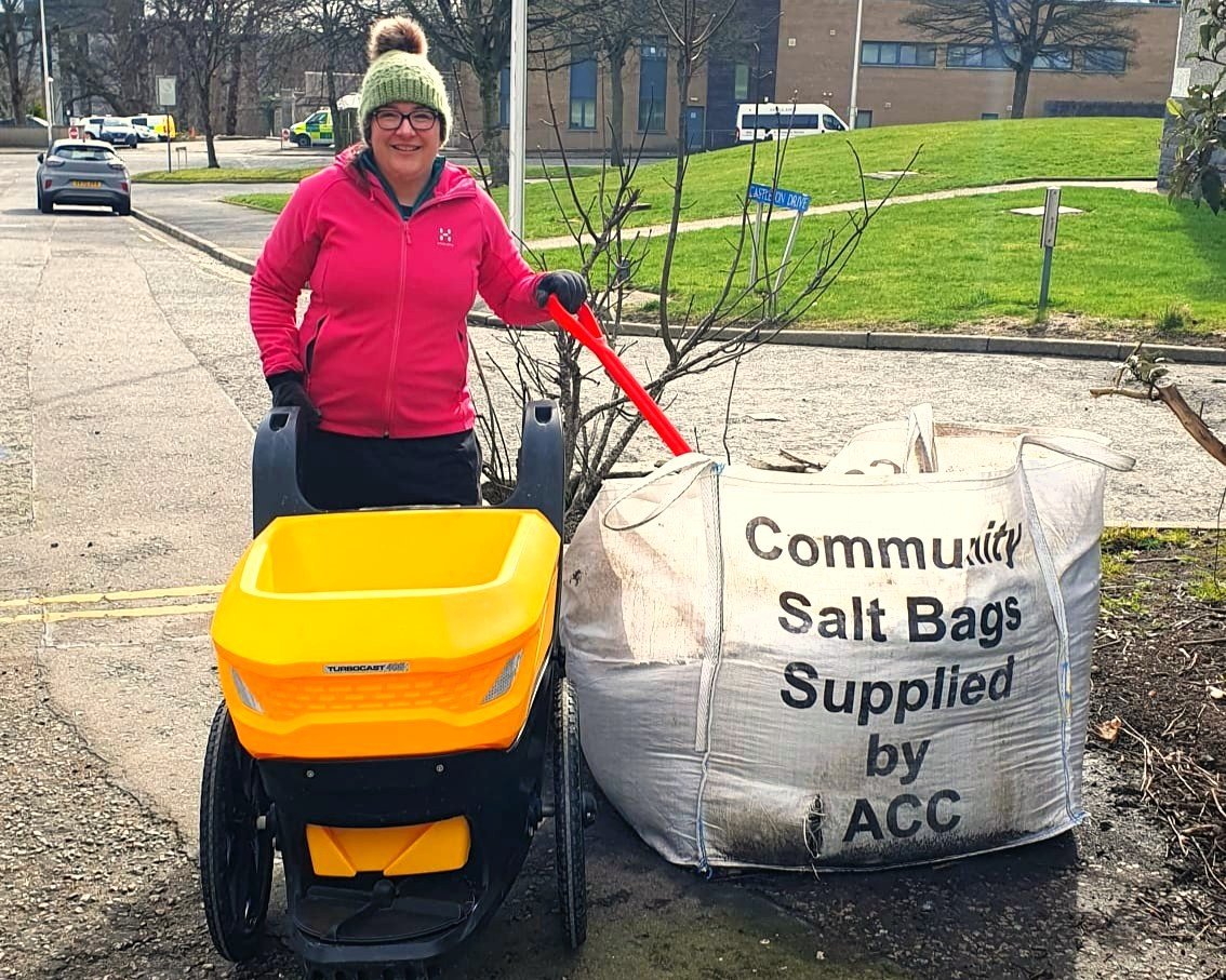 Fiona Meade with the salt-spreaders funded by a PCNZ grant Fiona Meade with the salt-spreaders funded by a PCNZ grant