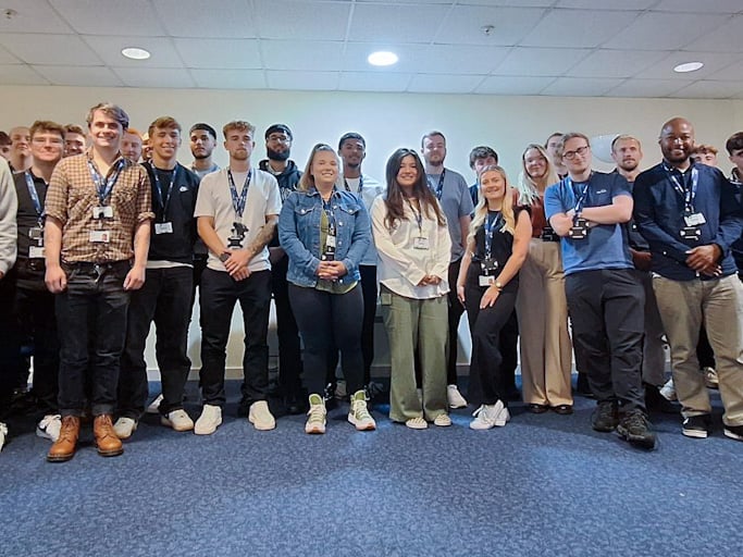 A wide angle image of the 44 new starts at SSEN photographed as a group indoors at our Thatcham Training Centre