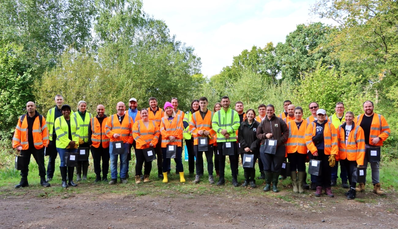 Group of people in woodland in high vis