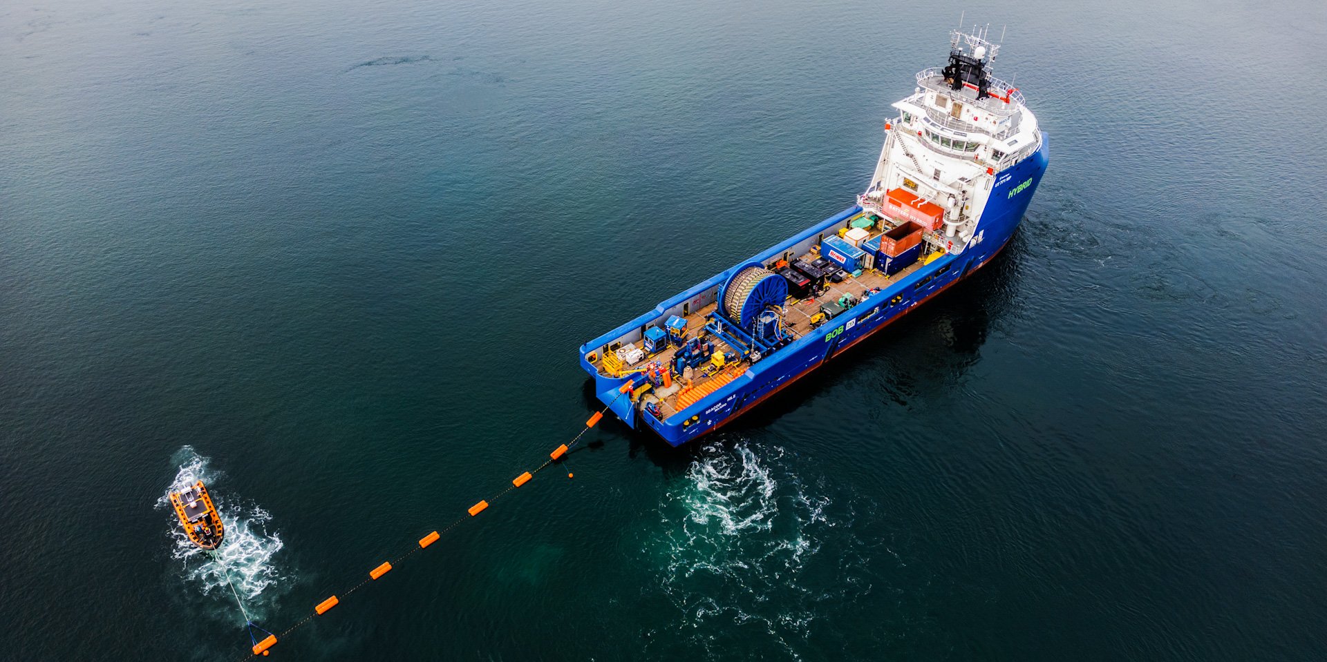 An aerial image of the cable-laying vessel Seecor Nile in the waters between Jura and Islay