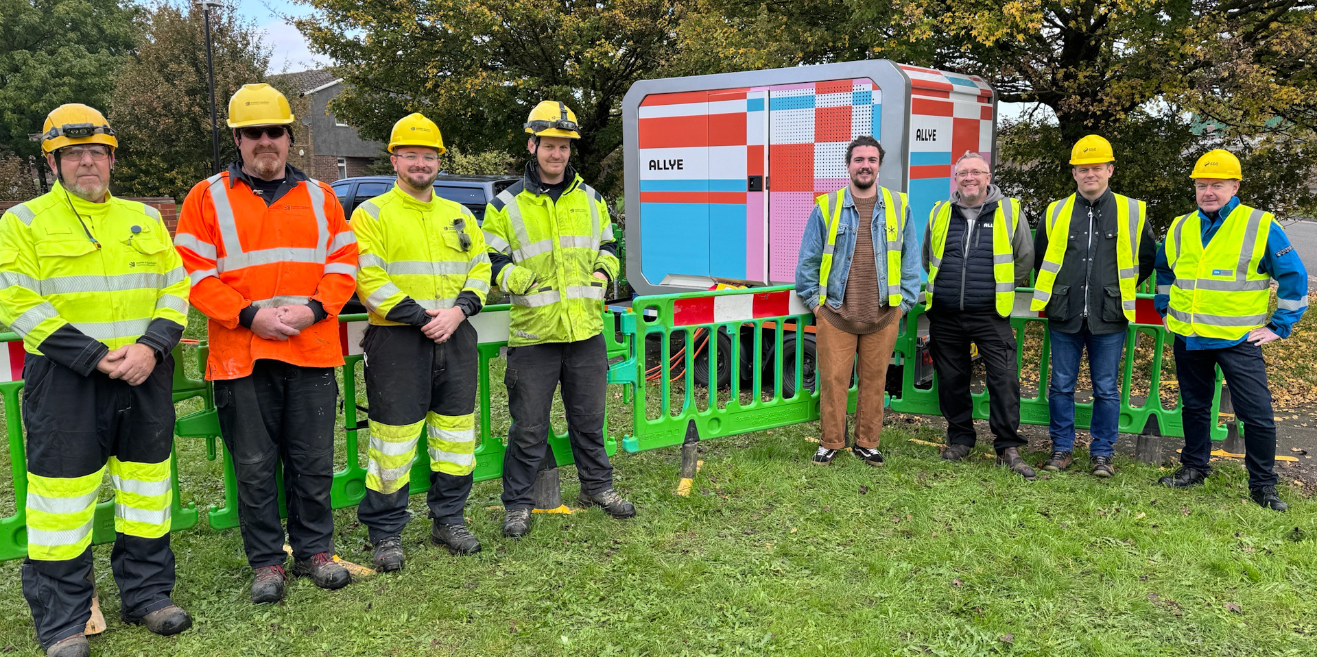 A group photo of the teams from SSEN and the battery developers in front of the device itself during the Slough-based trial