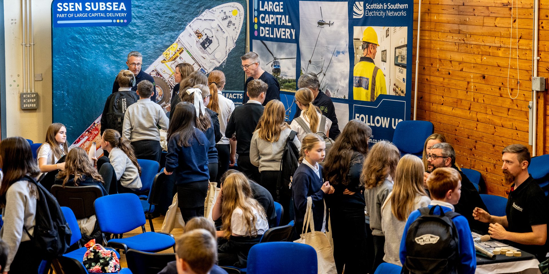 A wide shot of the SSEN teams speaking to school pupils at the event in Islay