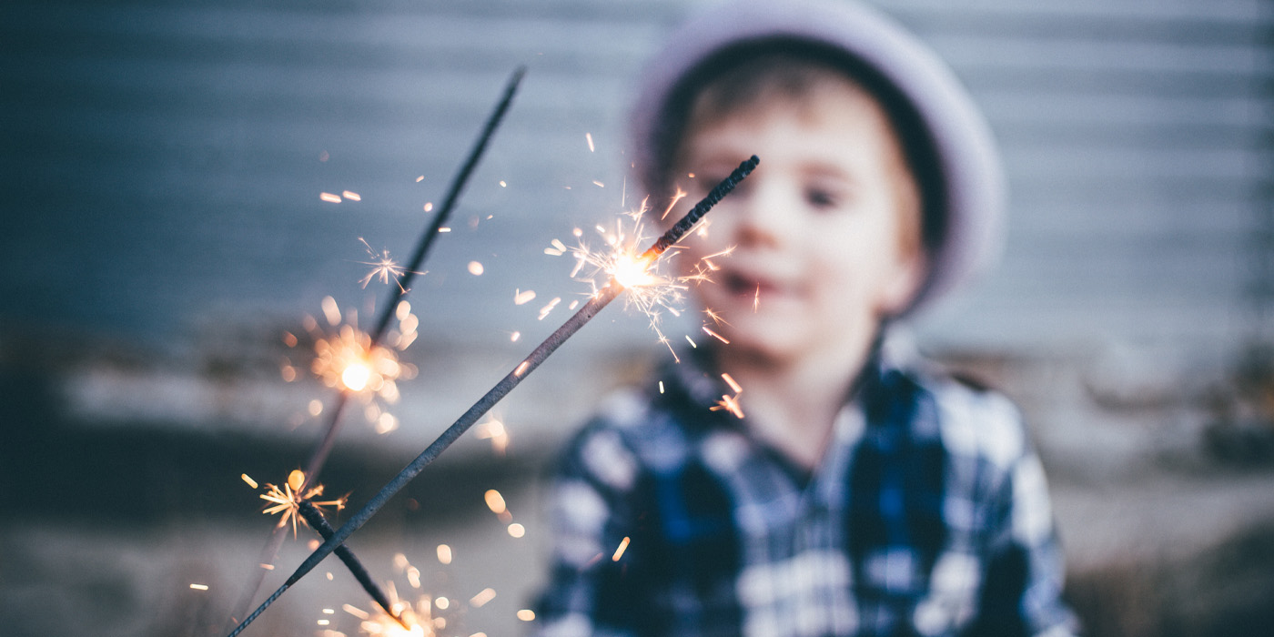 Child holding sparkler
