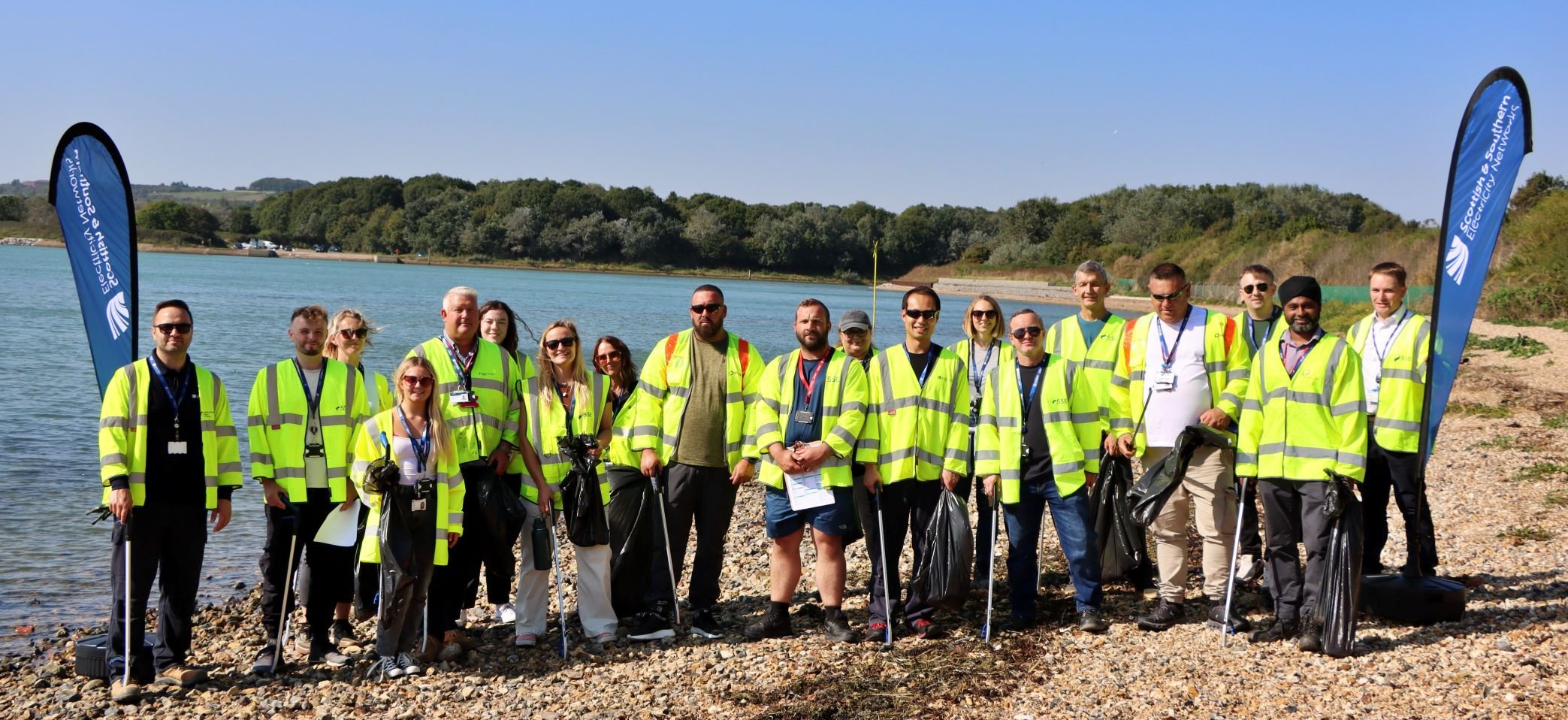 Team in high vis on beach