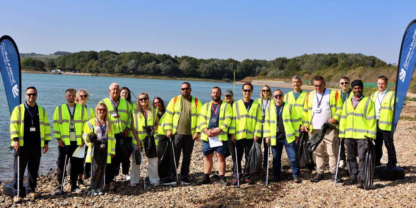 Team in high vis on beach