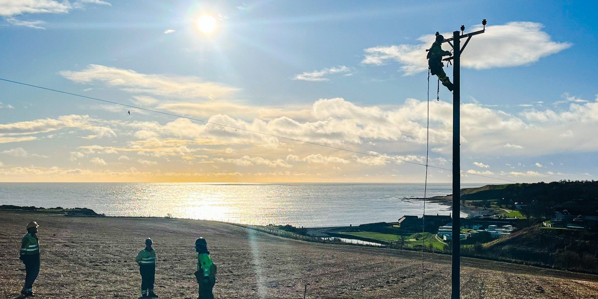 Engineers repairing the network near Inverbervie in Aberdeenshire near the coast